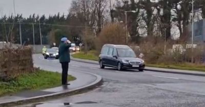 Retired Irish soldier dons uniform to salute Sean Rooney's coffin in touching tribute
