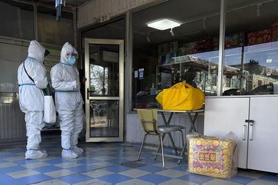 'Overwhelmed with bodies': Police guard Beijing crematorium as Covid deaths rise in China