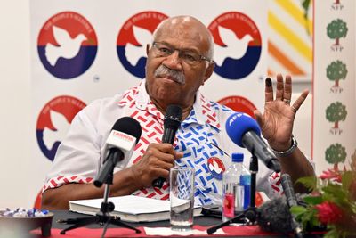 Rabuka promises change after winning close Fiji election