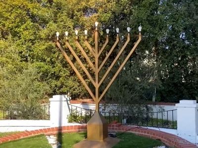 Man arrested for defacing menorah with Nazi symbols on first night of Hanukkah in Beverly Hills