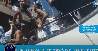 Terrifying scenes as Argentina fans jump from bridge onto player's bus during World Cup celebrations