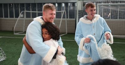 Kevin De Bruyne plays Santa as Manchester City stars pay Christmas visits to children