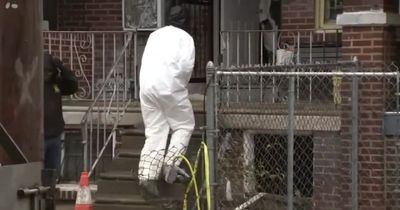 Police find body covered in concrete in the basement of hoarder's home after tip-off