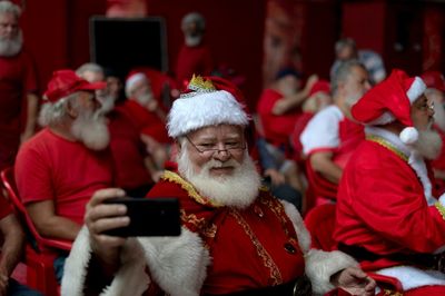 Lean times: Rio Santas line up for nourishing gifts. For themselves