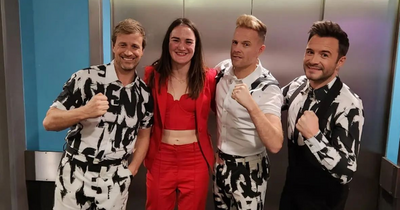 Kellie Harrington all smiles as she poses with Westlife after Christmas gig