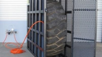 Man failed to use safety cage when killed by exploding tyre, Tasmanian coroner finds