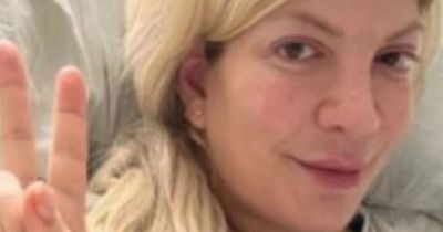 Tori Spelling slams trolls who said she faked illness as she shares snap from hospital