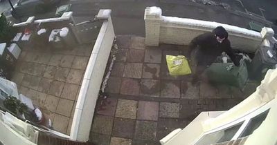 Moment Christmas Grinch is caught on CCTV stealing package hidden under wheelie bin