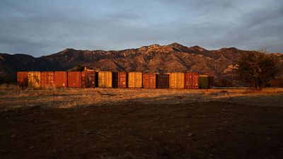 Arizona agrees to remove border wall of shipping containers