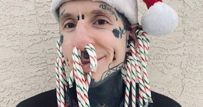 Dad obsessed with body modification puts candy canes through NOSE for Christmas