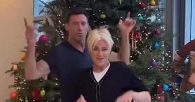 Hugh Jackman, 54, and his wife Deborra-Lee, 67, show off their dance moves for Christmas