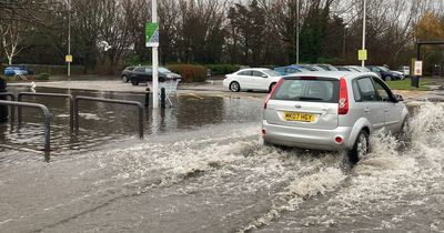 Shoppers struggle in flood water as rain batters Merseyside