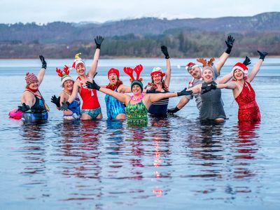 Pictures of the week: Thousands of penguins, the winter solstice and Christmas wild swimmers