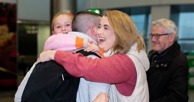Emotional scenes in Dublin Airport as families are reunited on busiest travel day before Christmas