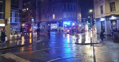 Emergency services lock down busy Scots street amid building fire in city centre