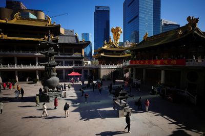 Hong Kong announces planned border re-opening with China as Omicron surges at Christmas