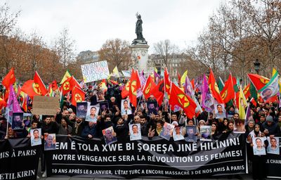 Police, protesters clash at rally denouncing deadly Paris attack