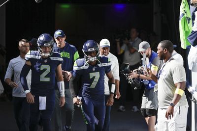 Geno Smith slow to get up from sack, Drew Lock warming up for Seahawks