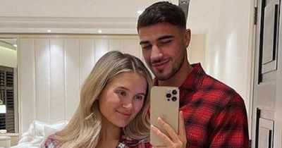 Mum-to-be Molly-Mae Hague shares adorable Christmas snaps as she shows off growing bump in festive PJs with Tommy Fury