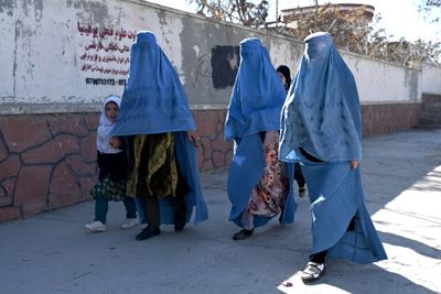 Taliban order NGOs to stop women staff from working over 'hijab'