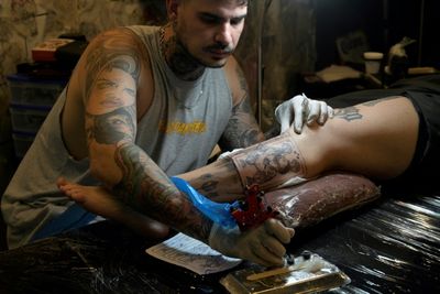 More than skin deep: Fans line up for Messi tattoos