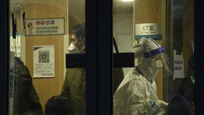 Xi urges steps to 'protect' lives as China relaxes Covid rules