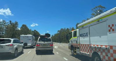 Cars banked up for eight kilometres after car crash on Pacific Highway