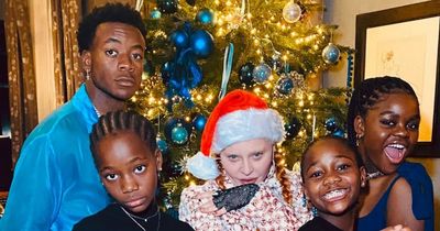 Madonna dresses 10-year-old twins in corsets and high heels for family Christmas snap