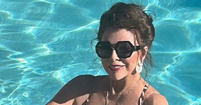 Joan Collins, 89, enjoys 'terrific' Christmas in leopard print swimsuit with husband Percy, 57