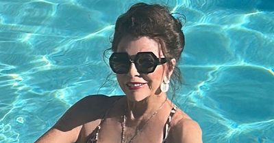 Joan Collins, 89, looks ageless she enjoys Christmas swim with husband Percy, 57