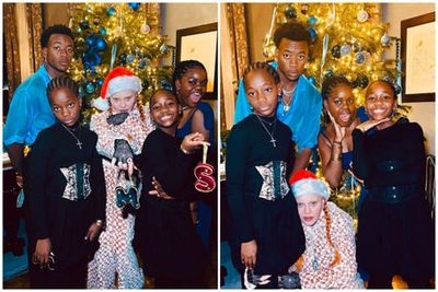 Madonna’s 10-year-old twin daughters wear corsets and high heels for family Christmas photo