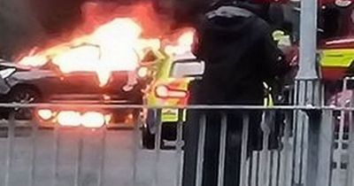 Pedestrian in hospital after being mowed down in attempted murder as car burst into flames