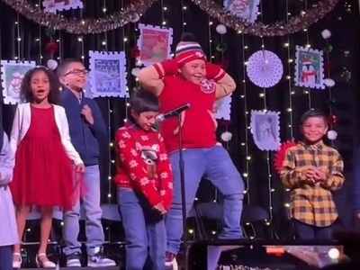 Eight-year-old steals the show with his dance moves at elementary Christmas concert