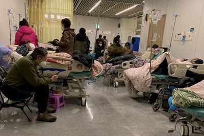 Chinese funeral homes and hospitals ‘extremely busy’ as Covid-19 spreads rapidly