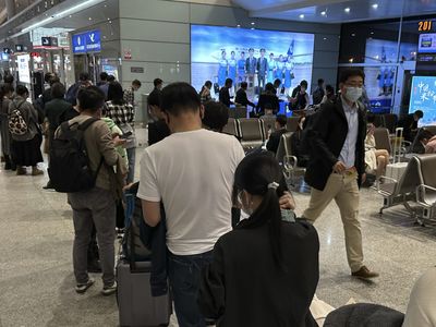 China says it will resume issuing passports and visas as virus curbs ease