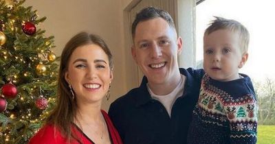 John McAreavey poses with son James as wife Tara cradles baby bump at nine months pregnant