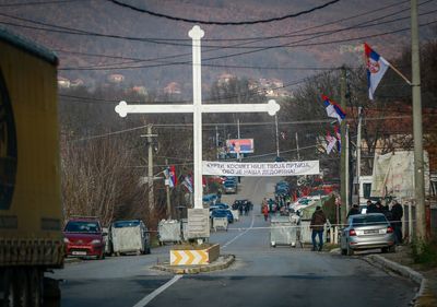 Kosovo reopens Serbia border crossing, roadblocks yet to go