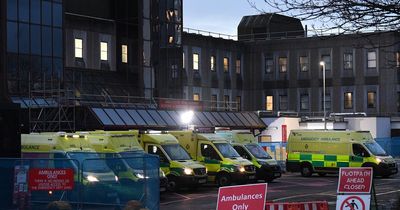 Pictures show queues of ambulances outside Greater Manchester hospital as pressure mounts on NHS