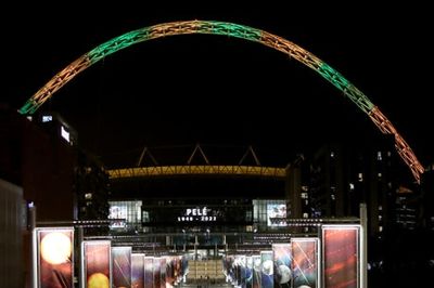 Wembley arch lit up in Brazil colours as football world mourns the death of Pele