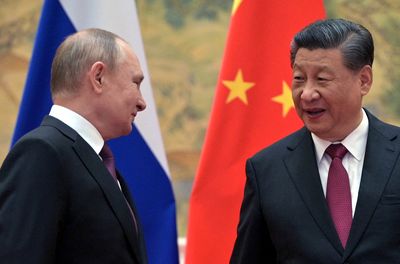 Putin expects China's Xi to visit soon, Xi holds his line on Ukraine