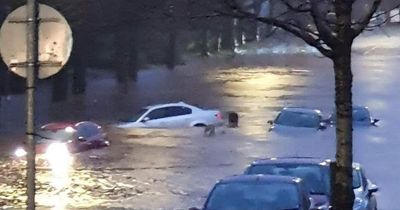 Cars left submerged in water as heavy downpours batter streets of Scots town