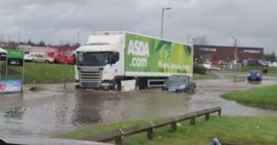 Entrance to Ayrshire Asda supermarket under water as heavy flooding hits region