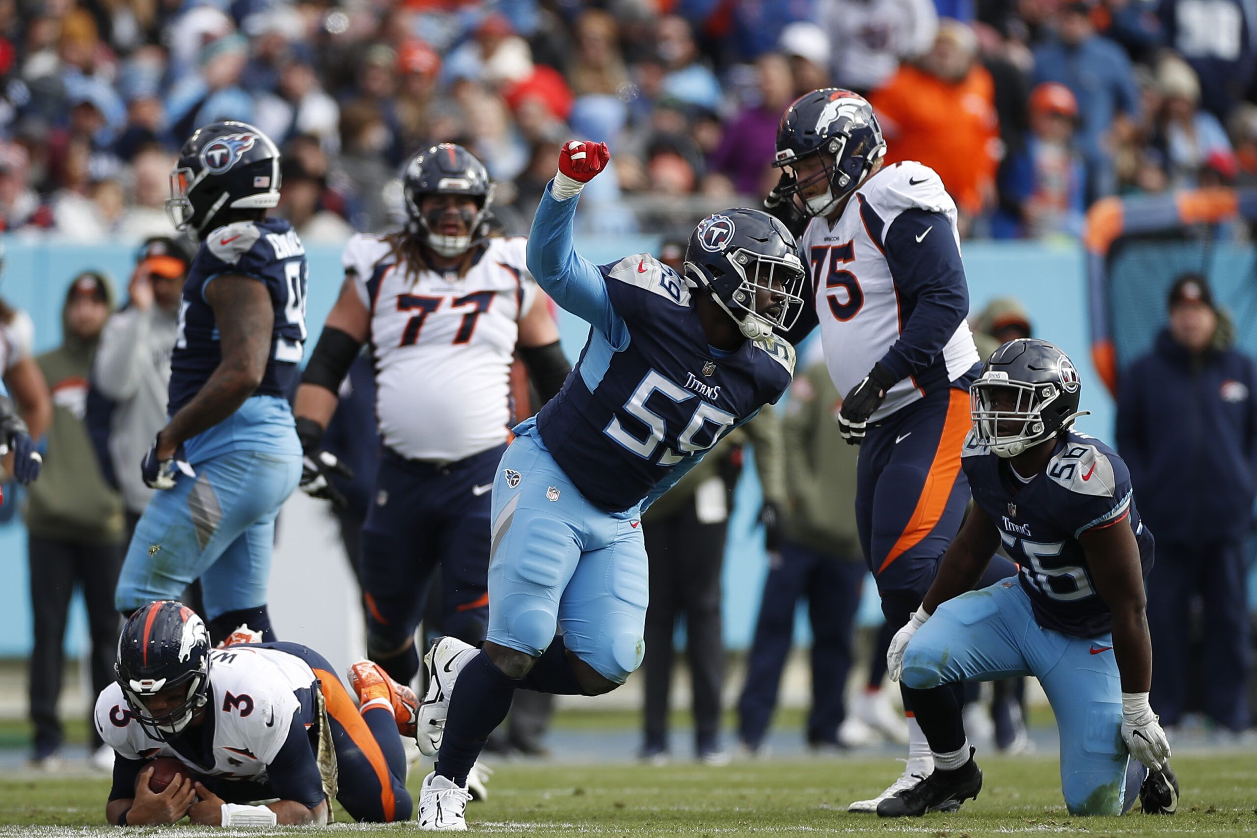 Titans waive Sam Okuayinonu, John Reid from active…