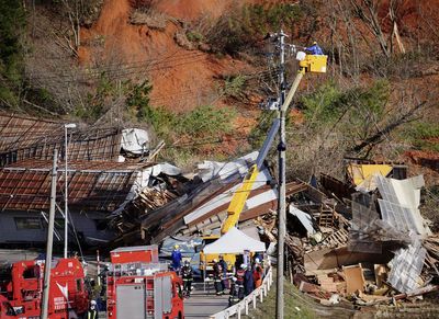 Troops join search for missing in northern Japan landslide