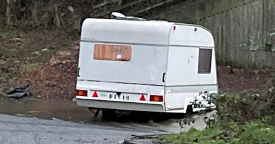Edinburgh caravan pictured being submerged on city road by concerned resident