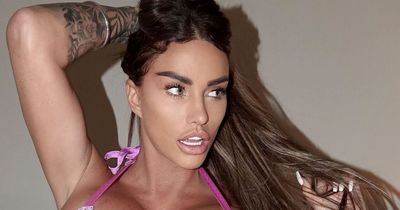 Katie Price shows off results of 'painful-looking' breast operation as she unbandages boobs
