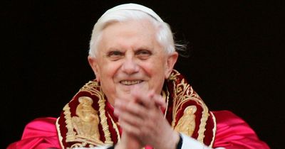Catholics across the world pray for late Pope Benedict XVI as his body lies in state