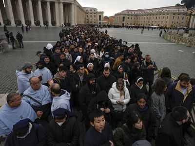 Thousands queue to pay tribute as the body of retired pope Benedict XVI lies in state