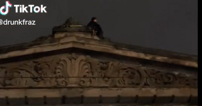Edinburgh snipers spotted on roof of the Dome at Hogmanay street party