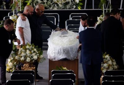 Pele’s coffin arrives at Santos stadium for legend’s funeral as fans queue up in thousands to pay respects